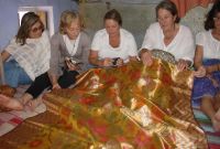Women admiring a sari worth Rs. 60,000 !